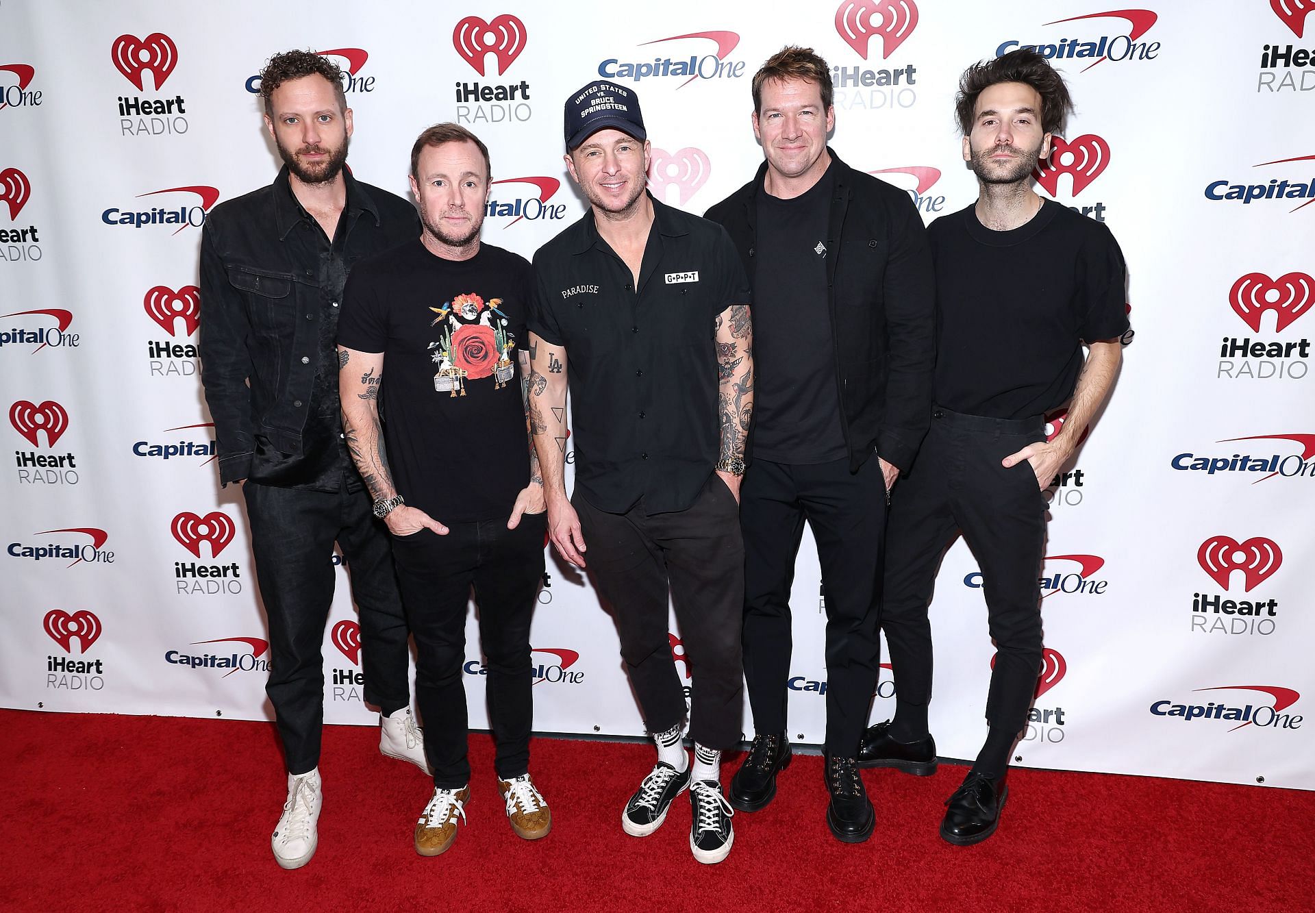 OneRepublic members, Brent Kutzle, Eddie Fisher, Ryan Tedder, Zach Filkins, and Brian Willett, attend iHeartRadio Hot 99.5's Jingle Ball 2023 (Image via Getty)